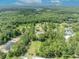 Aerial view of the sprawling property with wooded surroundings and manicured grounds at 2508 Fawn Run, Oviedo, FL 32765