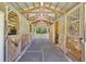 Interior view of the barn with a center isle, horse stalls, and an airy space at 2508 Fawn Run, Oviedo, FL 32765