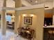 Inviting hallway with decorative table leading to dining room and kitchen areas at 2508 Fawn Run, Oviedo, FL 32765