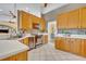 Kitchen featuring light wood cabinetry, stainless steel appliances, and tile backsplash at 2508 Fawn Run, Oviedo, FL 32765