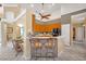 Kitchen island featuring breakfast bar with seating, and stainless steel appliances at 2508 Fawn Run, Oviedo, FL 32765