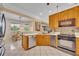 Kitchen features stainless steel appliances, neutral backsplash and breakfast nook dining area at 2508 Fawn Run, Oviedo, FL 32765
