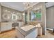 The main bath features dual sinks, granite counters, a vanity, a soaking tub, and a glass enclosed shower at 2508 Fawn Run, Oviedo, FL 32765