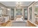 The main bath featuring a soaking tub, granite counters, a vanity, and large mirrors at 2508 Fawn Run, Oviedo, FL 32765