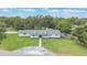 Aerial view of a home with a large front yard and mature trees at 102 Linda Ln, Lake Mary, FL 32746