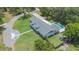 Sprawling home with a large manicured lawn, inground pool, and a long driveway at 102 Linda Ln, Lake Mary, FL 32746
