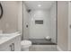 Stylish bathroom features a sleek, tiled walk-in shower and modern vanity at 102 Linda Ln, Lake Mary, FL 32746
