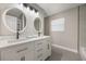 Bright bathroom features double sinks, marble countertop, modern fixtures and lighting at 102 Linda Ln, Lake Mary, FL 32746