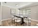 Bright dining room with contemporary furniture, neutral walls, and ample natural light at 102 Linda Ln, Lake Mary, FL 32746