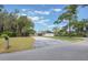 Charming one-story home featuring a spacious front yard, long driveway and mature landscaping at 102 Linda Ln, Lake Mary, FL 32746
