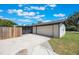 A white brick house featuring an attached two-car garage and a long driveway at 102 Linda Ln, Lake Mary, FL 32746
