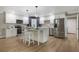 Bright kitchen with stainless steel appliances, island with seating, and white cabinetry at 102 Linda Ln, Lake Mary, FL 32746