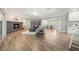 Open-concept living area showcasing a brick fireplace, neutral decor, and seamless flow to the dining space at 102 Linda Ln, Lake Mary, FL 32746