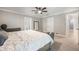 Spacious main bedroom with ceiling fan, ensuite bathroom, and large mirror at 102 Linda Ln, Lake Mary, FL 32746