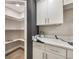 Pantry with marble countertop and ample shelving provides generous storage space at 102 Linda Ln, Lake Mary, FL 32746