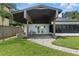 Covered back patio featuring brick floors and access to a large yard at 10209 Trout Rd, Orlando, FL 32836