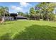 Large and manicured backyard featuring a covered patio at 10209 Trout Rd, Orlando, FL 32836