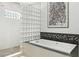 Bright bathroom featuring a shower and bathtub with glass block window accents at 10209 Trout Rd, Orlando, FL 32836