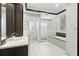 Elegant bathroom with glass block shower, soaking tub, vanity and sleek fixtures at 10209 Trout Rd, Orlando, FL 32836