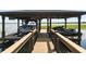 Boat lift containing a boat and jet ski on the water at 10209 Trout Rd, Orlando, FL 32836