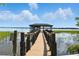 Dock leading to a covered boat lift on the water at 10209 Trout Rd, Orlando, FL 32836