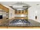 Close up of kitchen island with granite countertop and stainless steel appliances and hood vent at 10209 Trout Rd, Orlando, FL 32836