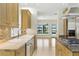 Gourmet kitchen featuring custom cabinetry, stainless steel appliances, granite counters and views of the waterfront at 10209 Trout Rd, Orlando, FL 32836