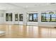 Spacious living room featuring hardwood floors, lots of natural light, and access to the backyard at 10209 Trout Rd, Orlando, FL 32836