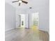 Main bedroom with doors to en-suite and closet featuring neutral paint and flooring at 10209 Trout Rd, Orlando, FL 32836