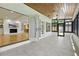 Bright sun room with wood plank ceilings and tile floors leads into the living room at 10209 Trout Rd, Orlando, FL 32836