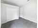 A simple bedroom with tiled flooring and closet at 109 Greentree Ln, Yalaha, FL 34797