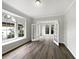 A bright room with french doors and large arched windows at 109 Greentree Ln, Yalaha, FL 34797