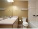 A well lit bathroom with a vanity and a shower/bath tub combo at 1131 S Pine Ridge Cir # 1, Sanford, FL 32773