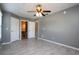 The bedroom featuring tile floors, with an attached bathroom and walk in closet at 1131 S Pine Ridge Cir # 1, Sanford, FL 32773
