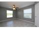 A simple bedroom featuring tile floors, ceiling fan, and lots of light at 1131 S Pine Ridge Cir # 1, Sanford, FL 32773