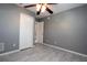 The bedroom featuring tile floors, with a nearby closet and doorway at 1131 S Pine Ridge Cir # 1, Sanford, FL 32773