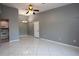 Spacious living room with gray walls, tile floors, open to kitchen at 1131 S Pine Ridge Cir # 1, Sanford, FL 32773