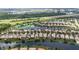 Community aerial view showcasing lakes and manicured landscapes in a well-planned neighborhood at 12286 Regal Lily Ln, Orlando, FL 32827