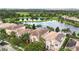 Beautiful homes with well-manicured lawns overlooking a tranquil lake at 12286 Regal Lily Ln, Orlando, FL 32827