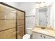 Bathroom featuring glass-enclosed shower, vanity with granite countertop, and neutral palette at 12286 Regal Lily Ln, Orlando, FL 32827