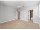 Bedroom with carpet, white ceilings, multiple closets and access to a bathroom at 12286 Regal Lily Ln, Orlando, FL 32827