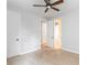 Bright bedroom with carpet, ceiling fan and view of multiple doors and closets at 12286 Regal Lily Ln, Orlando, FL 32827