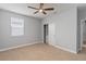 Bedroom with neutral carpet, ceiling fan, window with blinds and a closet at 12286 Regal Lily Ln, Orlando, FL 32827