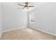 Neutral bedroom with carpet, a ceiling fan, and a window providing natural light at 12286 Regal Lily Ln, Orlando, FL 32827