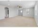 Expansive bonus room with carpet, ceiling fan and multiple windows allowing natural light at 12286 Regal Lily Ln, Orlando, FL 32827