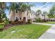 Charming two-story home with a brick driveway, well-manicured lawn, and mature landscaping at 12286 Regal Lily Ln, Orlando, FL 32827
