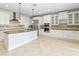 Spacious kitchen with granite countertops, stainless steel appliances, and white cabinetry at 12286 Regal Lily Ln, Orlando, FL 32827