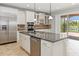 Kitchen featuring stainless steel appliances, granite countertops, and lake view at 12286 Regal Lily Ln, Orlando, FL 32827