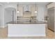 Kitchen island featuring granite countertop, breakfast bar, and pendant lighting at 12286 Regal Lily Ln, Orlando, FL 32827