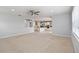 Spacious living room featuring neutral carpet, recessed lighting and an open floor plan at 12286 Regal Lily Ln, Orlando, FL 32827